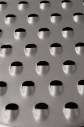 17750   Close up of sharp blades on metal food grater