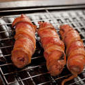 17252   Close up of cooked pigs in blankets on oven tray