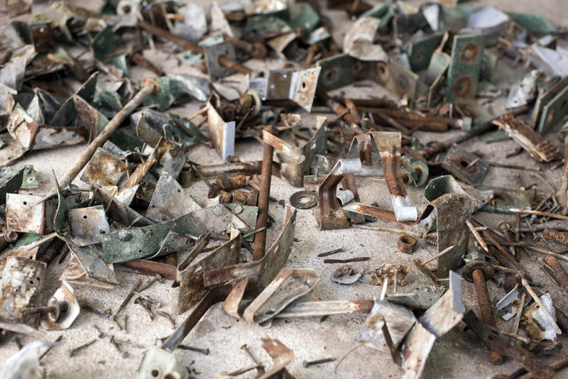 Large full frame jumble of rusted metal parts conceptual of industrial waste and pollution