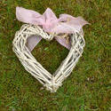 17363   Wicker heart with pink ribbon on the grass