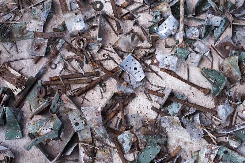 Background texture of discarded rusty corroded old metal parts lying in a jumble conceptual of industrial waste