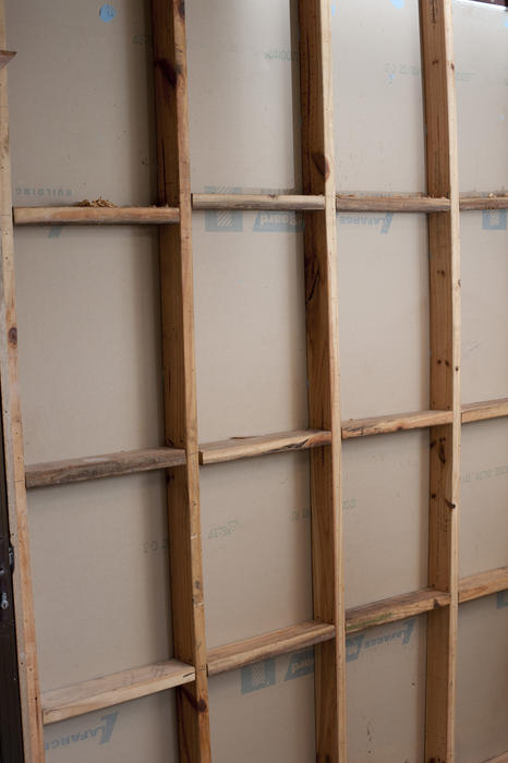 View of the inside the stud wall of a frame house before insulation and plasterboard installed