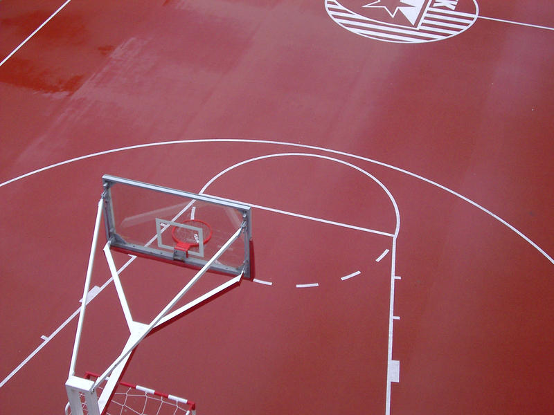 an outdoor red couloured baskteball colour viewed from above