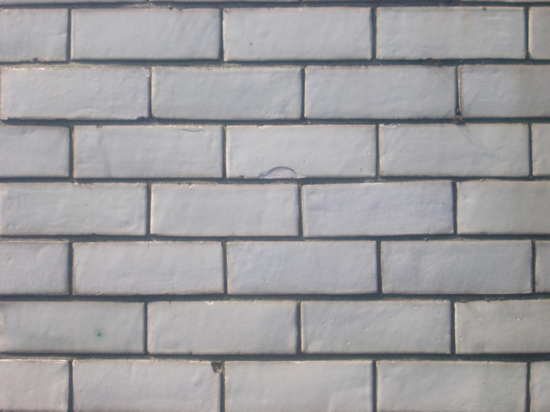 pattern of a white glazed brick wall