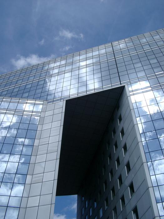 reflections in the windows of modern corporate architecture, paris, france