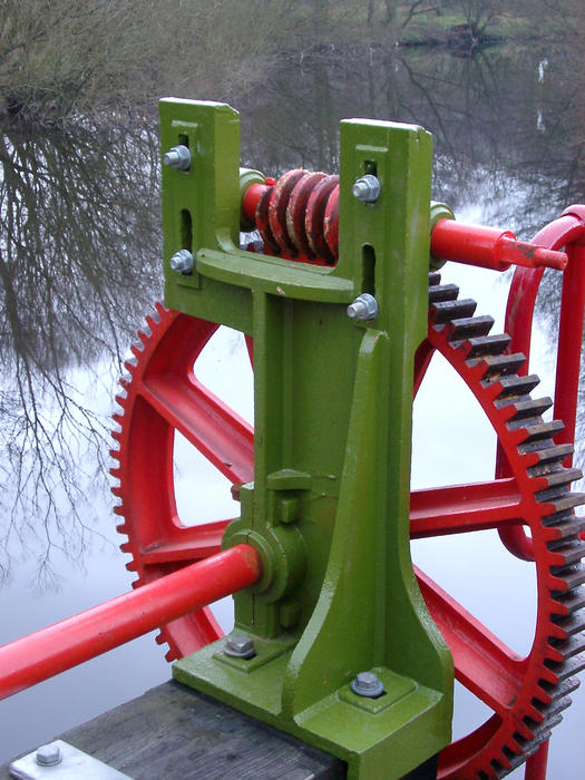 mechanical hand crank used to control water flow over a wier