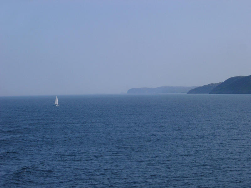 sailing in open water in small catamaran
