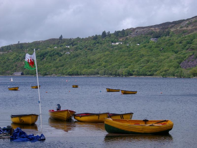 rowing boats on the lake at llanberis, north wales, uk