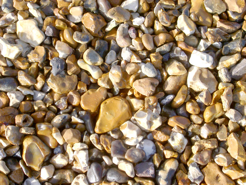small shiney sea washed stones on a beach