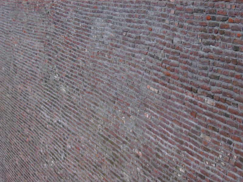 uneven perspecitve patterns in a large brick wall