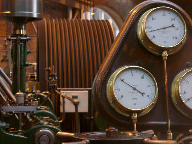 brass steam gauges on a steam engine