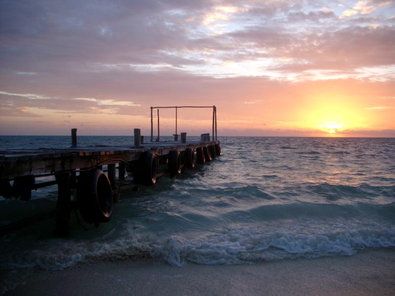 sun rising over the caribbean sea, punta allen, mexico.