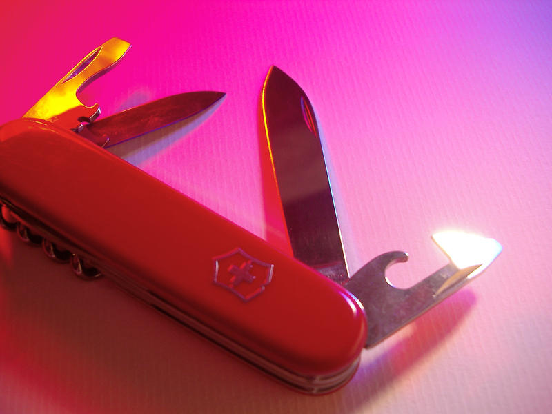 detail of the blades of a red swiss army knife