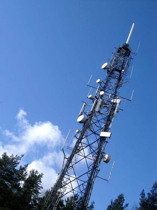 a tv transmission mast with microwave dishes