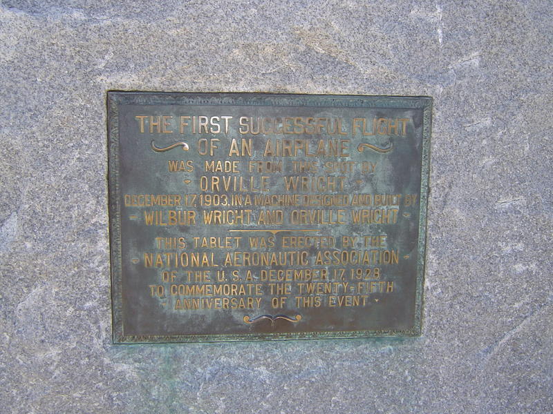 a metal plaque commerating the first successful flight by the wright brothers
