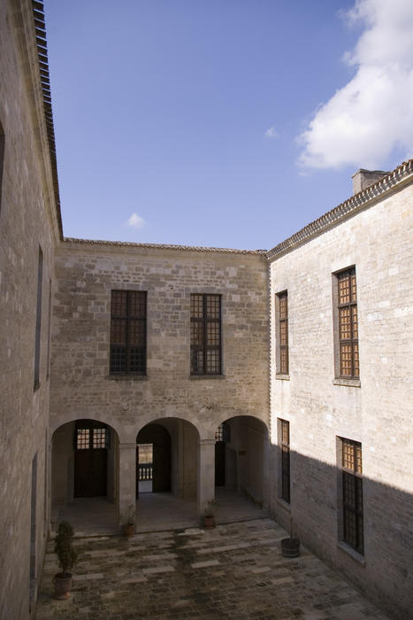 a stone courtyard in an old french building