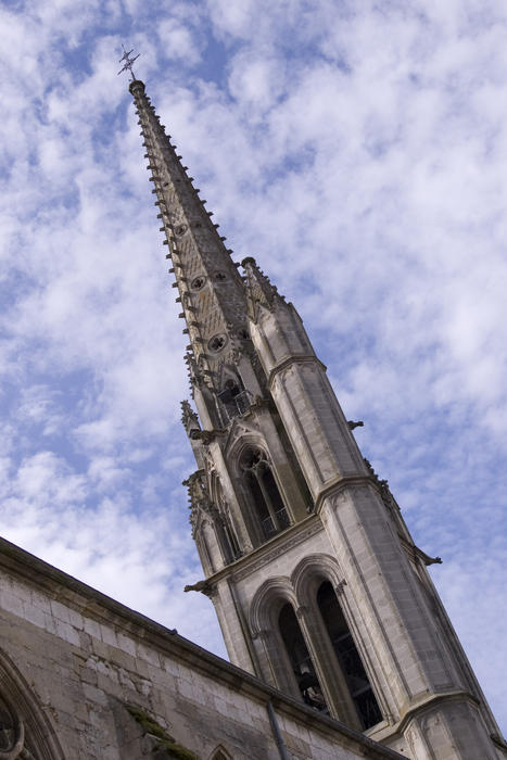 a french church tower with distinctive asymetric design