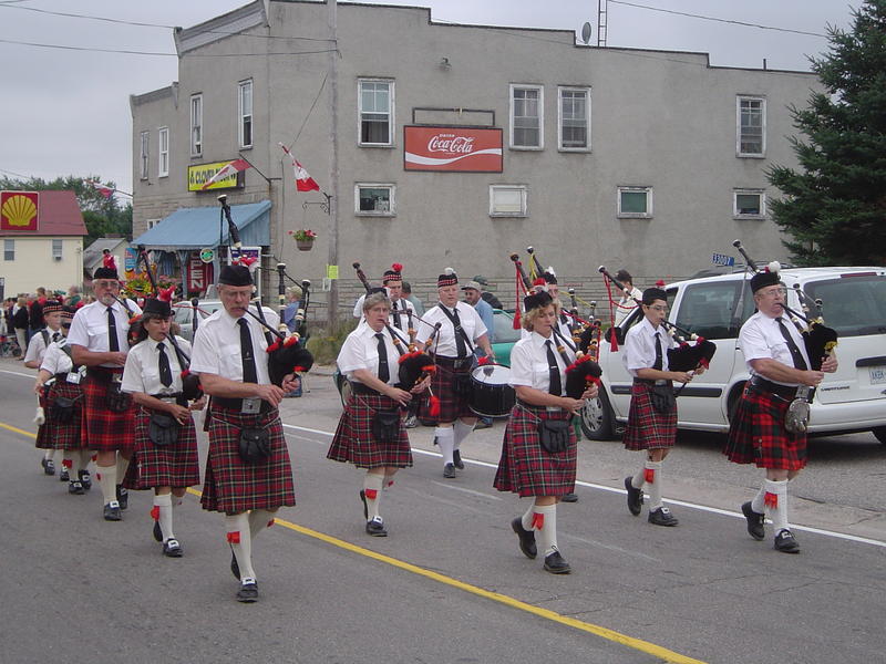 local parade in ontraio, canada includes a bag pipe band