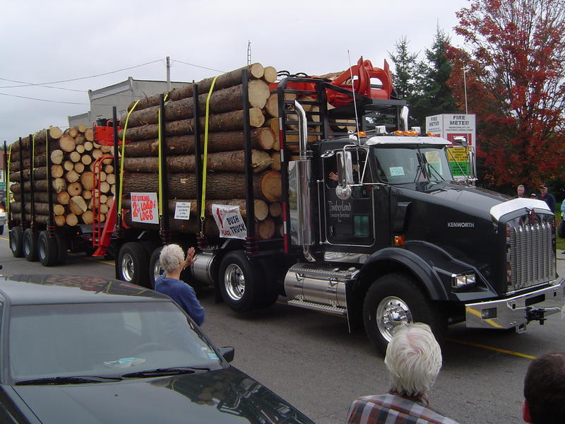 parade of logging trucks and forestry machinery, ontarion, canada