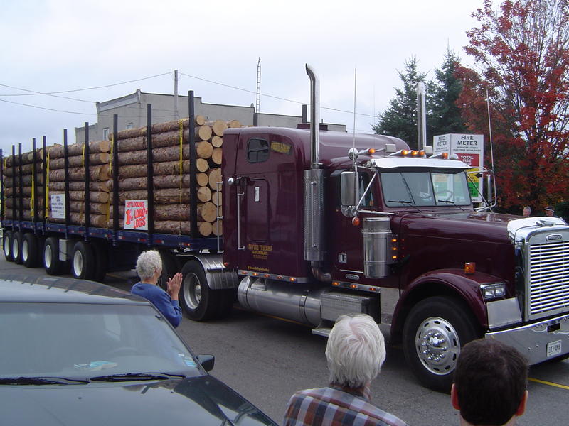 parade of logging trucks and forestry machinery, ontarion, canada