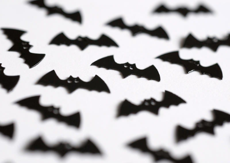 bat shaped halloween party decorations pictured with a narrow depth of field