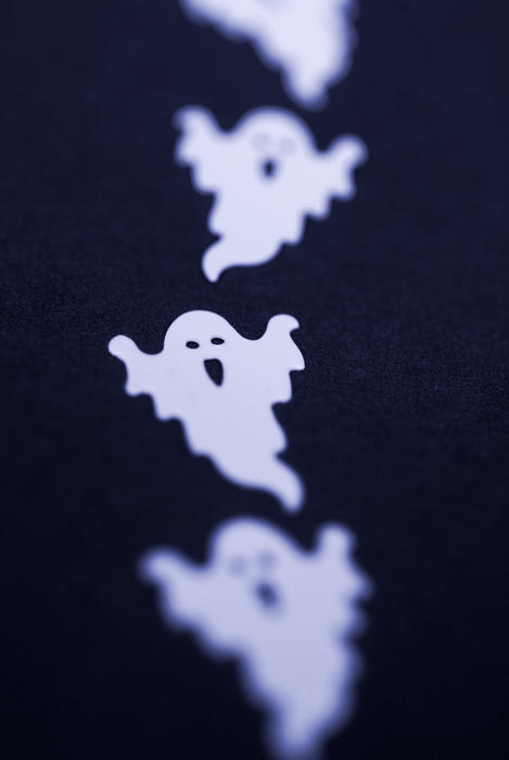 spooky halloween spectres - a line of small plastic halloween ghosts