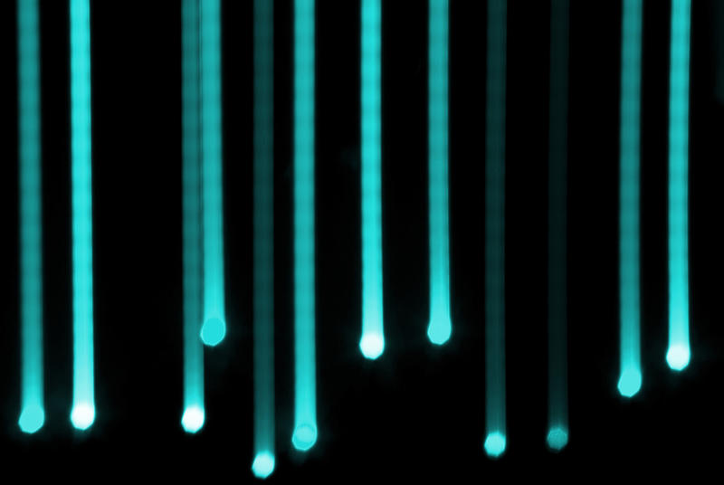 aquamarine coloured lines of light create a 'falling' effect