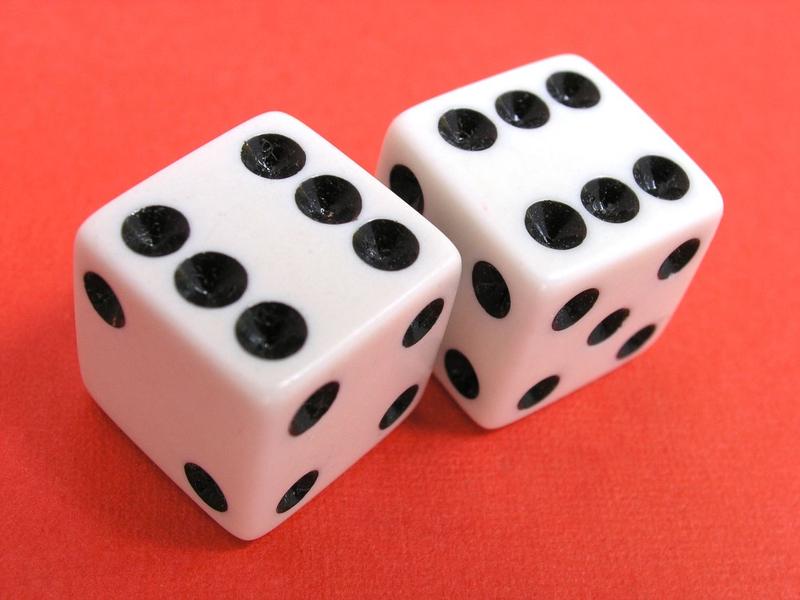 <p>Dice showing sixes on red background. Larger high resolution image available <a target="_blank" href="http://alexhd57.clustershot.com/photo763301">here</a>.</p>Lucky Dice showing a pair of sixes.