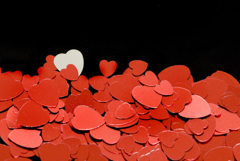 <p>More valentine images in our <a href="http://www.freeimages.co.uk/jumpto/valentine.htm">valentine photo gallery</a></p>metallic reflective red love heart shapes on a black background