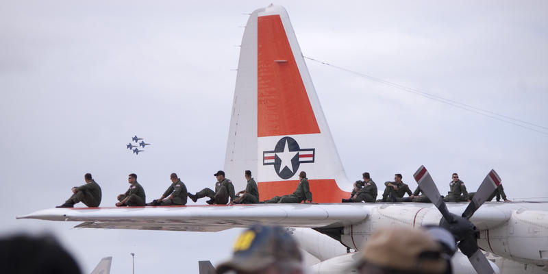editorial use only : crew line up on the tailplane of a USCG hercules during an airshow
