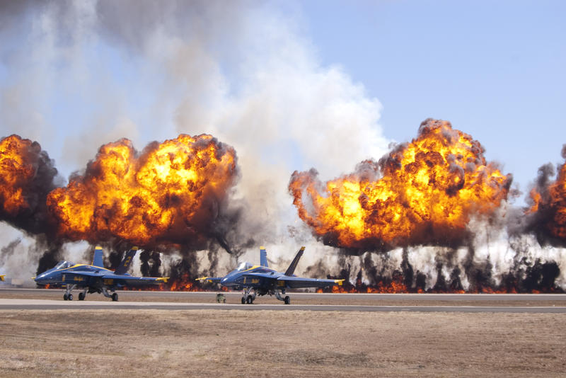 fire balls exploding during an airshow display