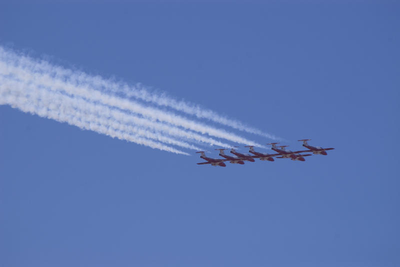 jet aircraft performing a formation fly by an aviation show