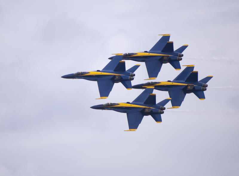 the blue angels display team in a diamond formation display
