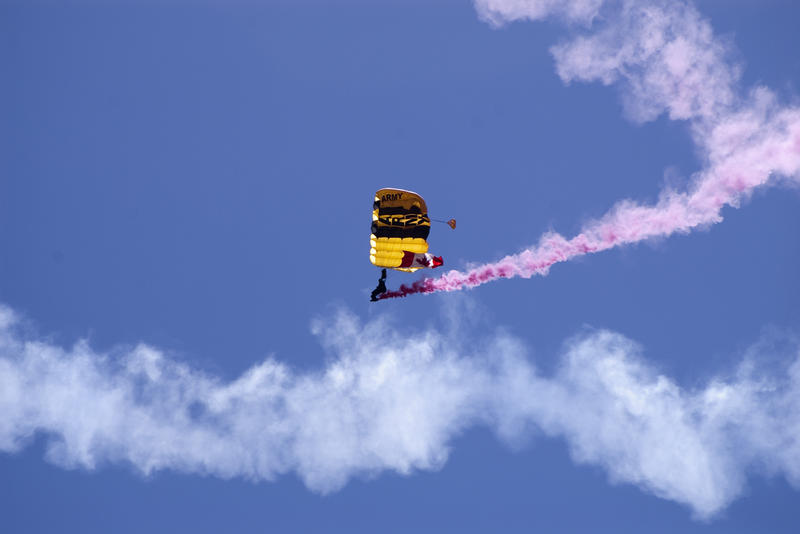 an army paratrooper performing a demo at an air show