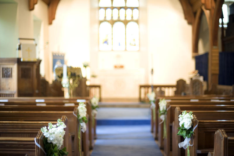 a church aisle pictured with a narrow depth of field to give an ethereal or dreamy effect
