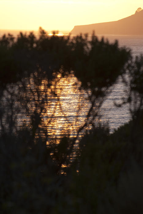 sunset over california's famous bigsur coastline