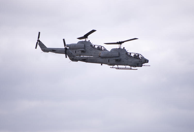 A pair of AH-1W Cobra Helicopters gunships in flight