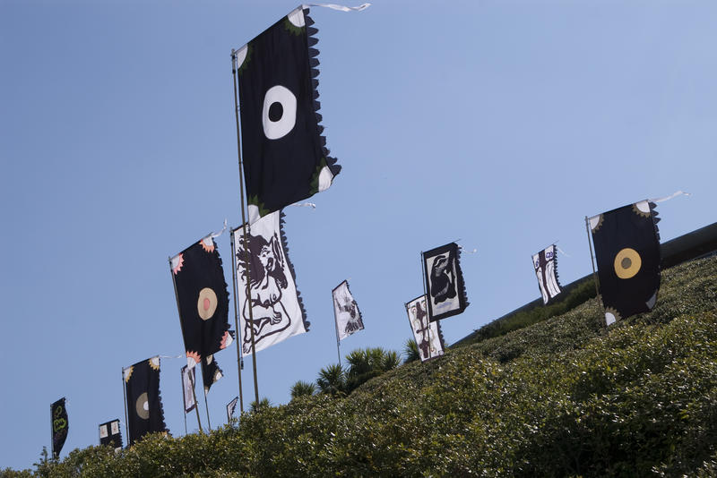 black coloured banners wave in the wind at the eden project