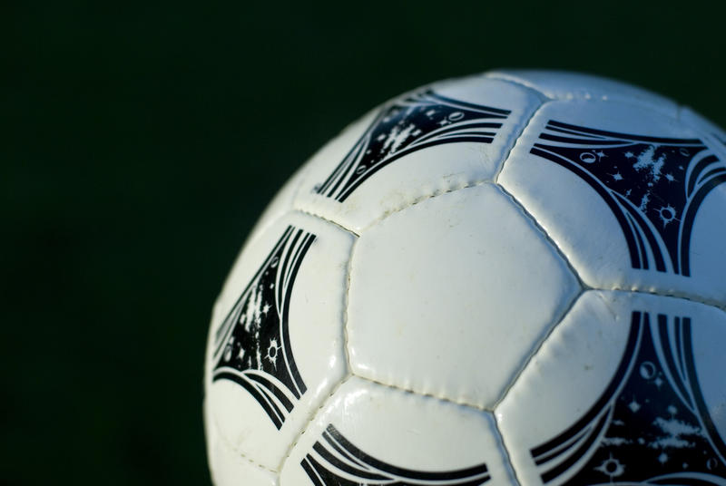 close up on a white leather professional soccer ball