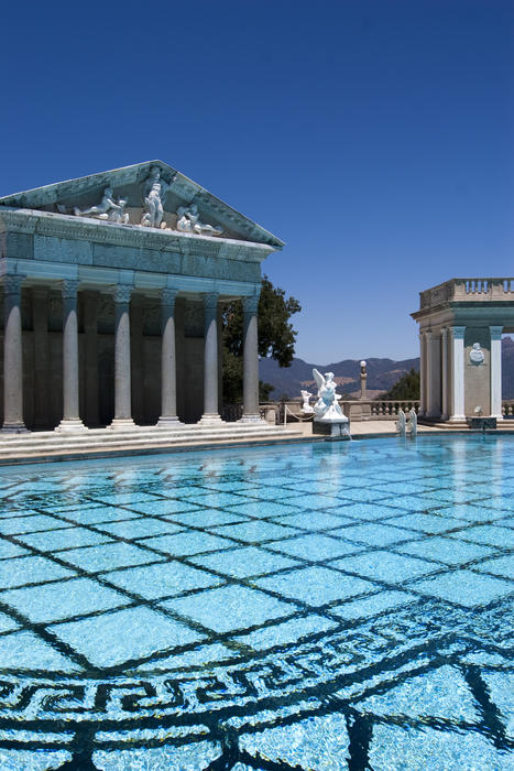 Editorial Use Only: Cyan waters of Hearst Castles famous neptune pool with romanesque architecture, Designed by architect Julia Morgan