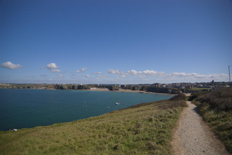 a view of the cornish town of newquay from the towan head coastal footpath