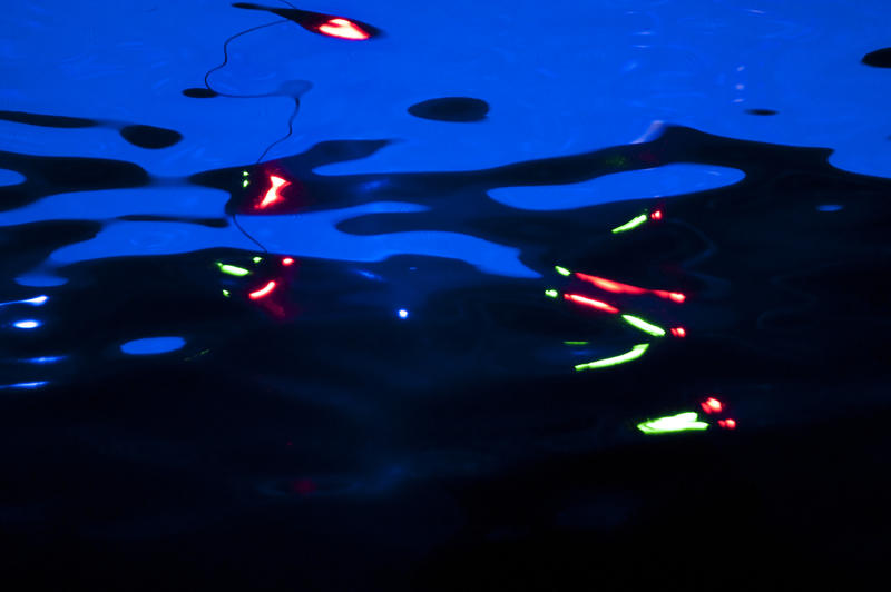 abstrqact image of lights reflection of the surface of rippling water