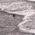 2731-surfer paddling out