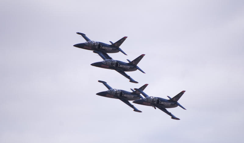 the patriots jet display team in a formation flyby