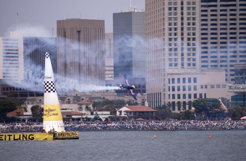 editorial use only : a plance flying through the finish gate at a red bull air race