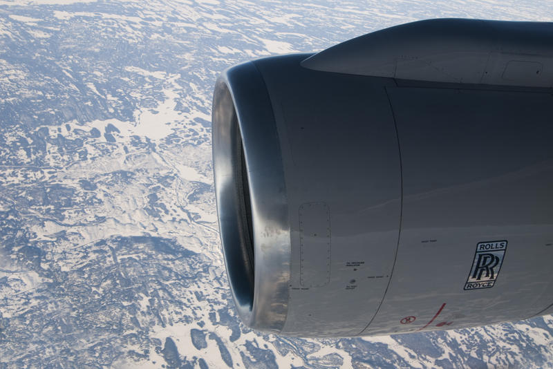 looking out of a plane window at a jet engine