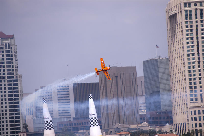 editorial use only : a plane flys through the finish gate at the san diego red bull air race