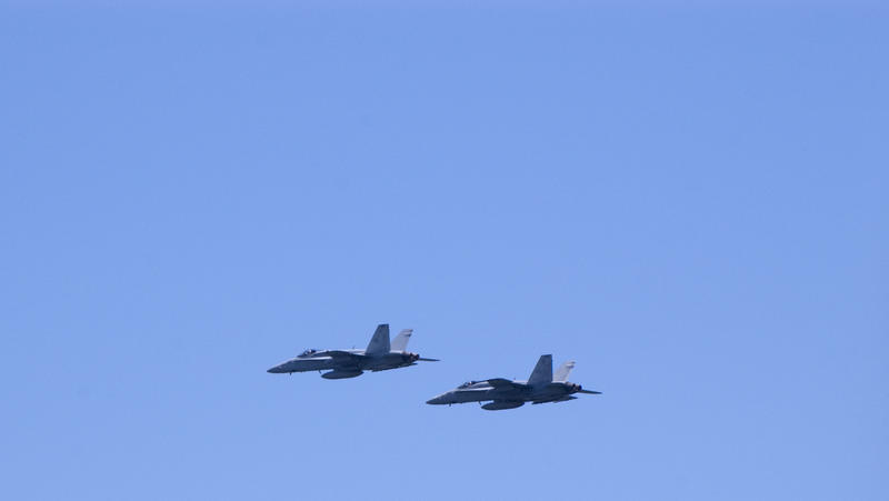 A pair of FA18 Super hornet aircraft flying against a blue sky