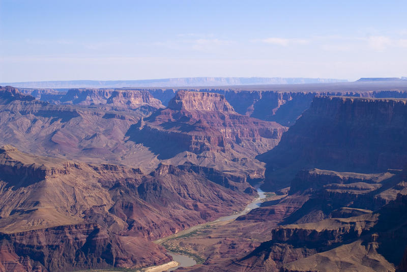 a view of the colarado river from the desert view watch tower over the grand canyon
