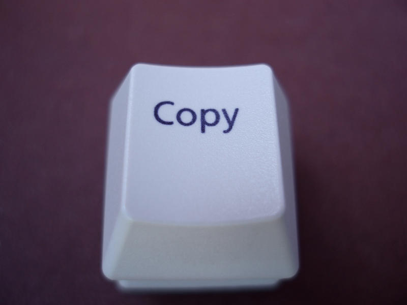 a copy button form a computer keyboard conceptual of software and data theft